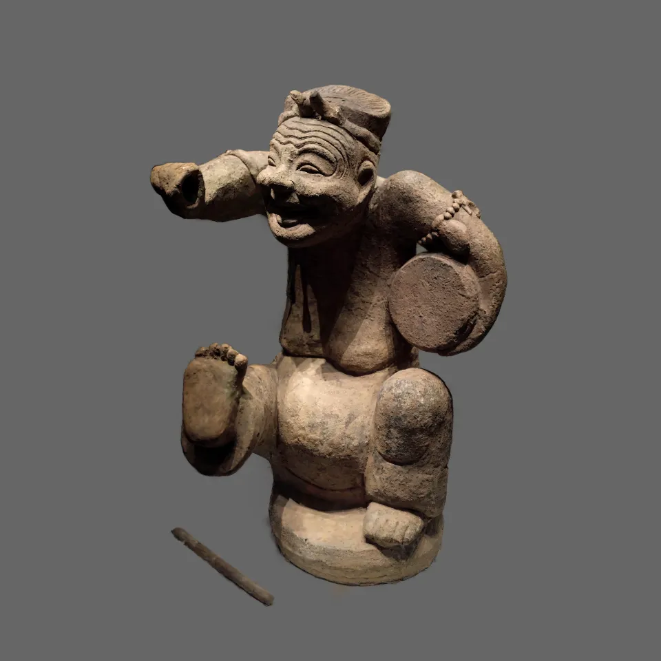 Rapping Clay Figurine