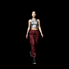 Woman in silver top and red pants