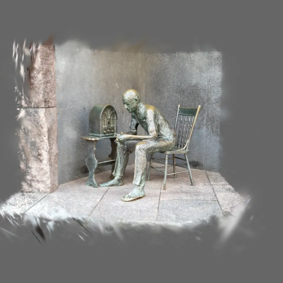 Man listening to radio sculpture