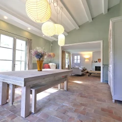 Elegant living room with fireplace in a renovated provençal home