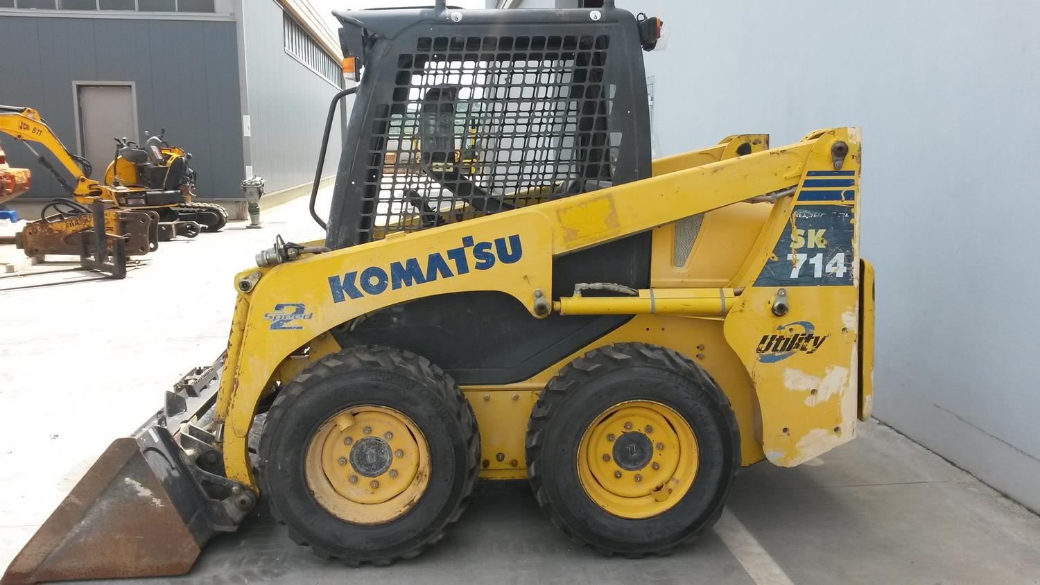 Lot Komatsu SK 714 skid steer