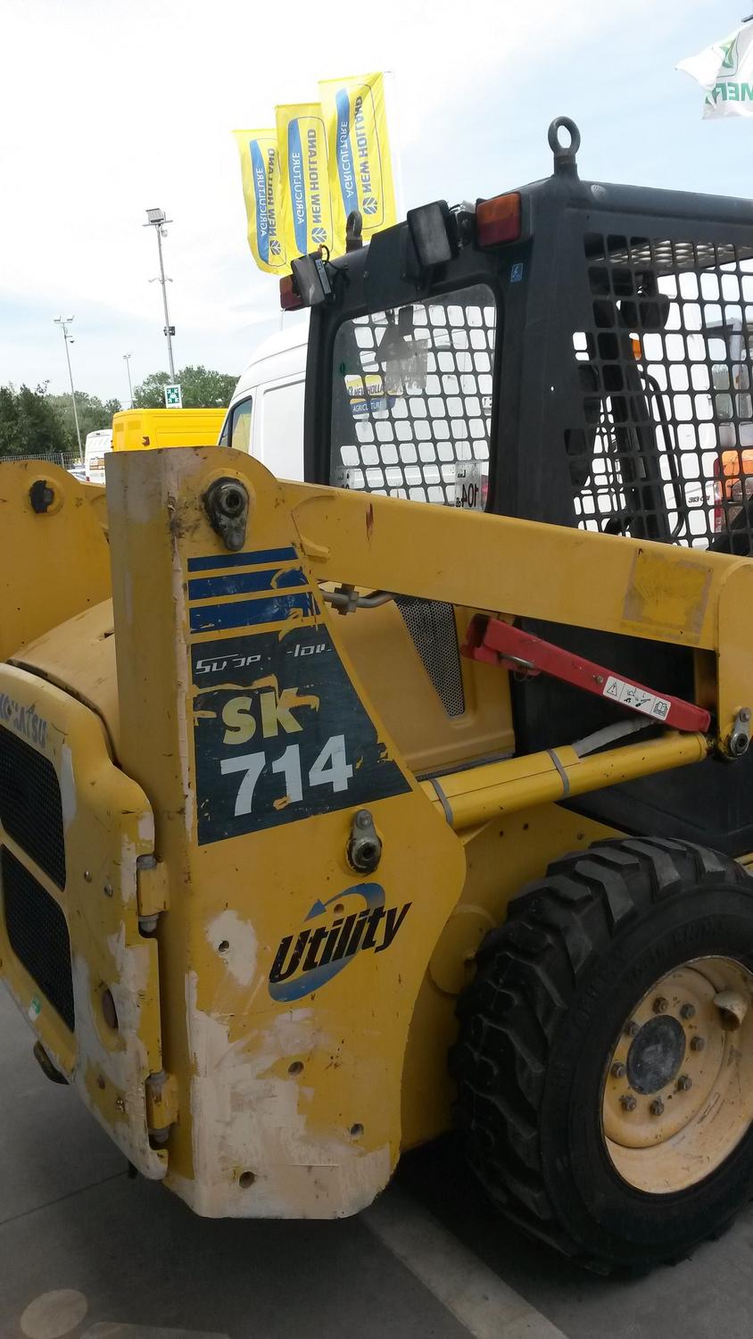 Lot Komatsu SK 714 skid steer