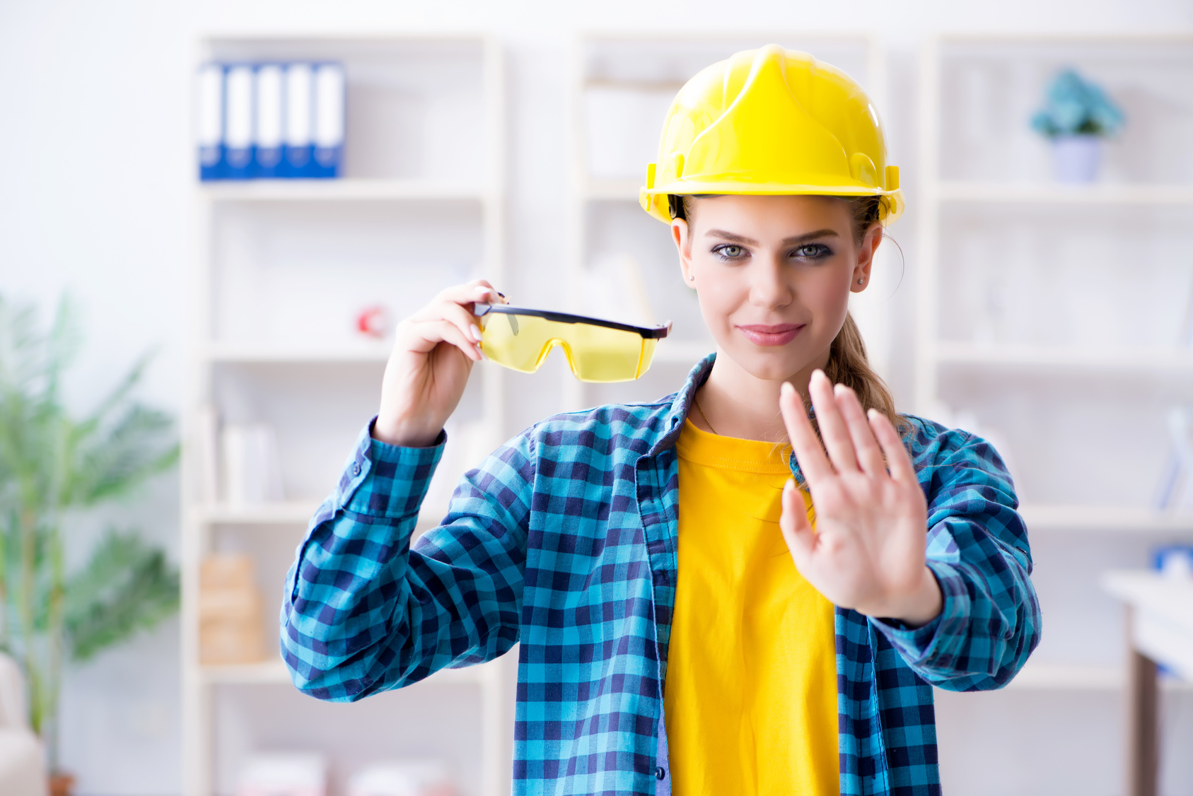 woman construction worker being safe on the job