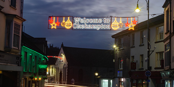 A festive illuminated sign reading 