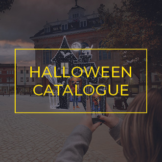 Large Haunted Halloween house photo opportunity feature with family talking a photo on phone