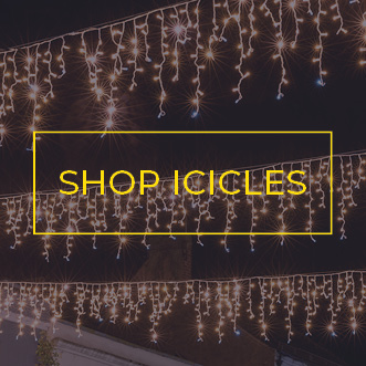 Warm white icicle lights strung across a street