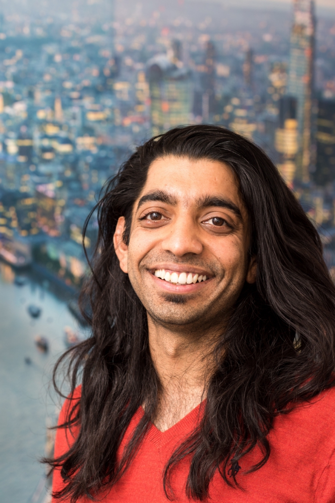 part with thick flowing hair, large soulful eyes and a beaming