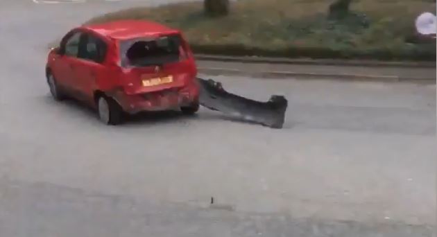 Police chase car with bumper hanging off through Reading town centre