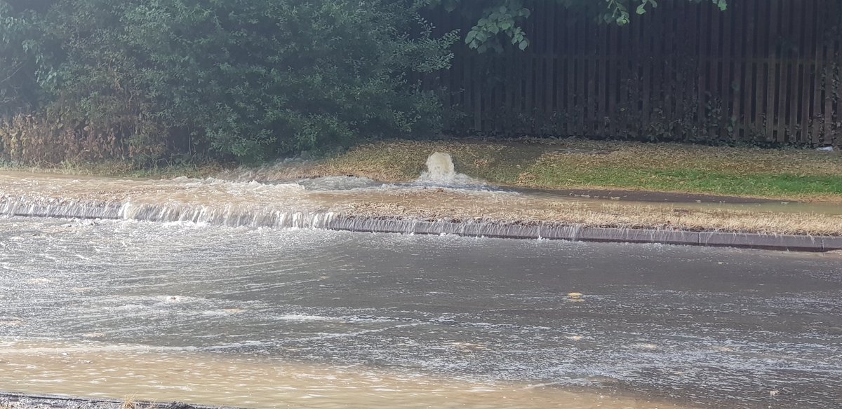 Burst water main floods Woosehill road