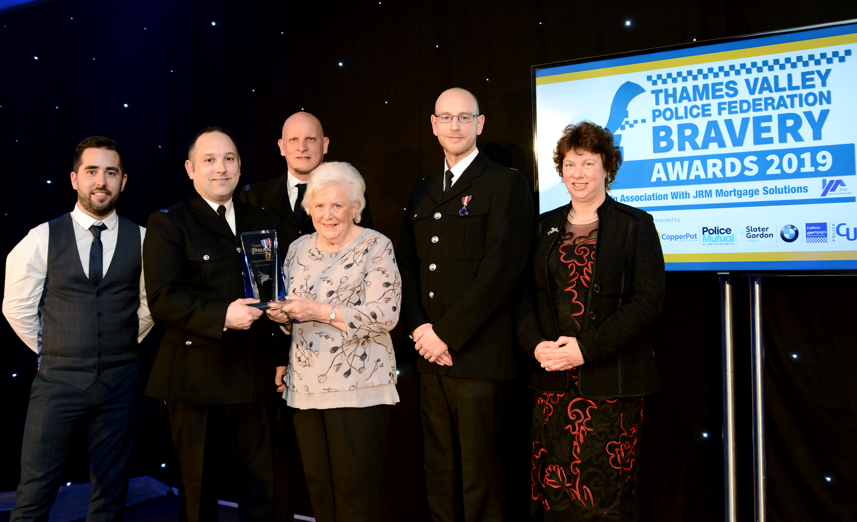 Awards recognise brave officers who rescued a woman from a blazing house fire