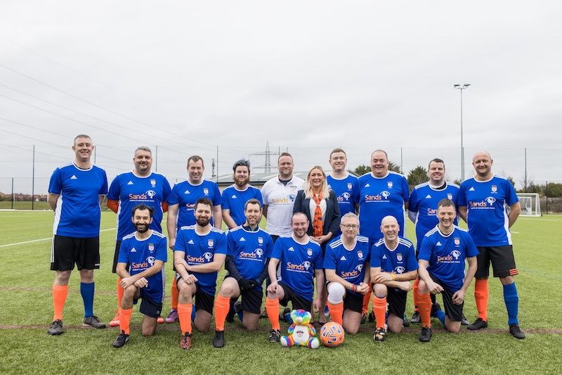 Heartfelt donation given to football club for bereaved dads