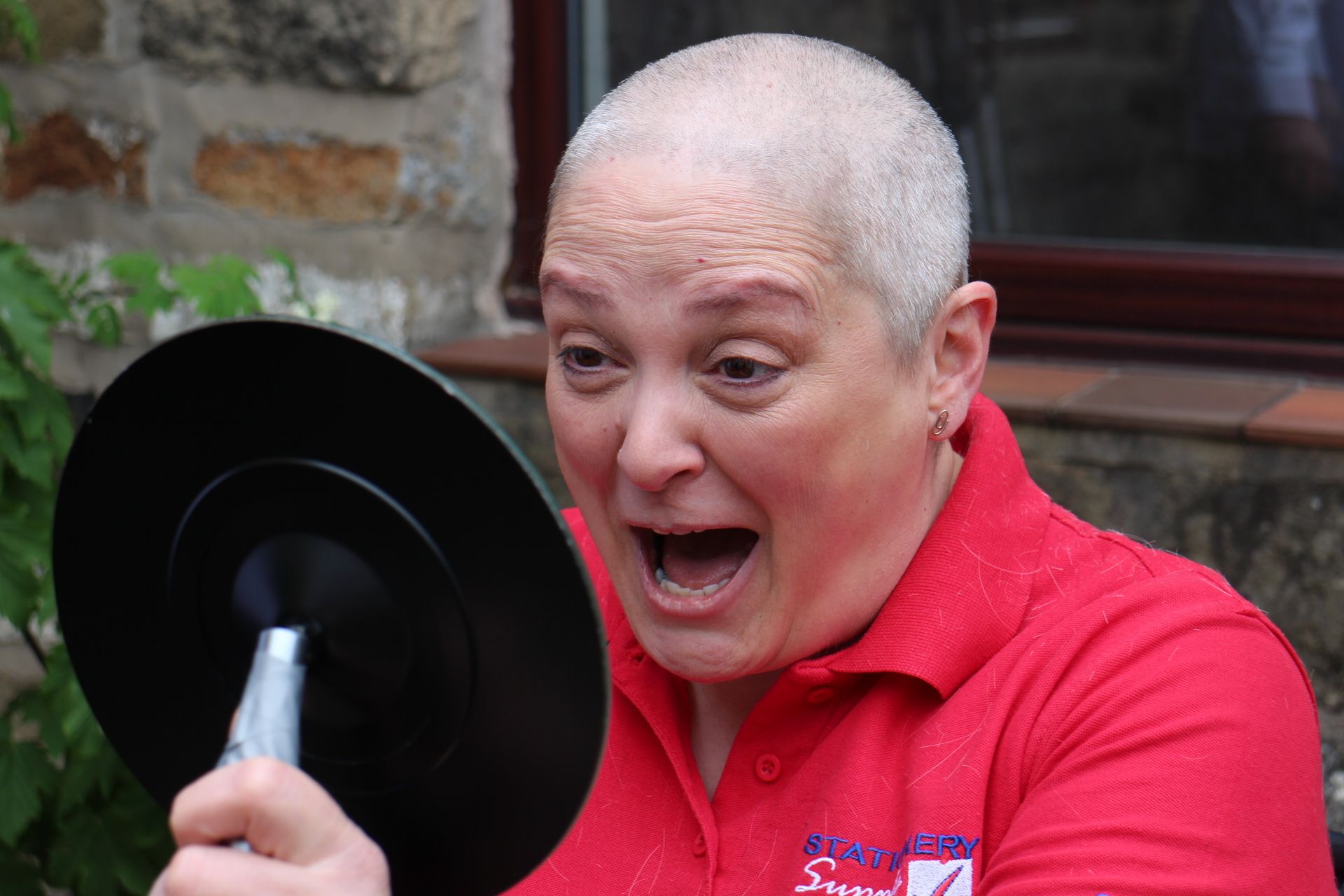 Fundraising Marple woman shaves head for charity