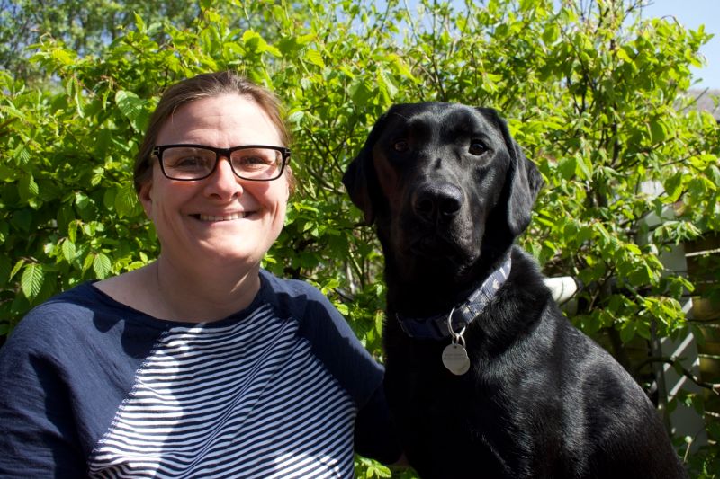 Horwich assistance dog helps owner tend to garden