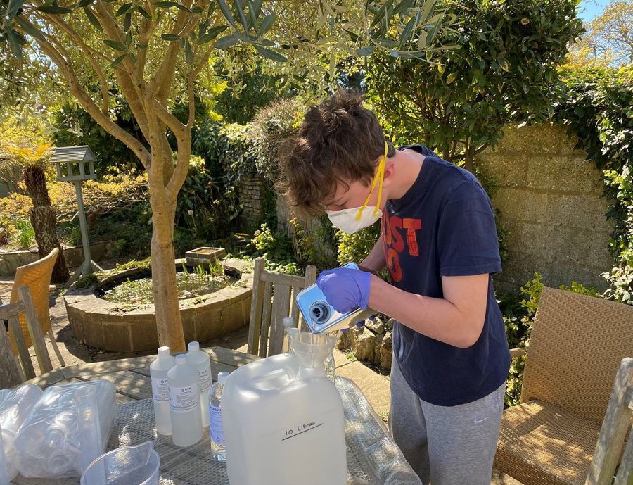 Witley pupil Chris produces hand sanitiser for the community