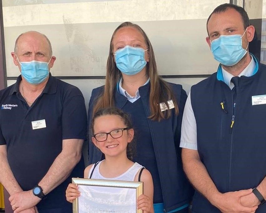 Children urge rail passengers to wear masks and social distance