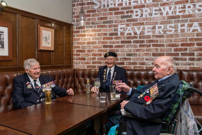 “Knock and Check” campaign launches with lunch for a WWII veteran