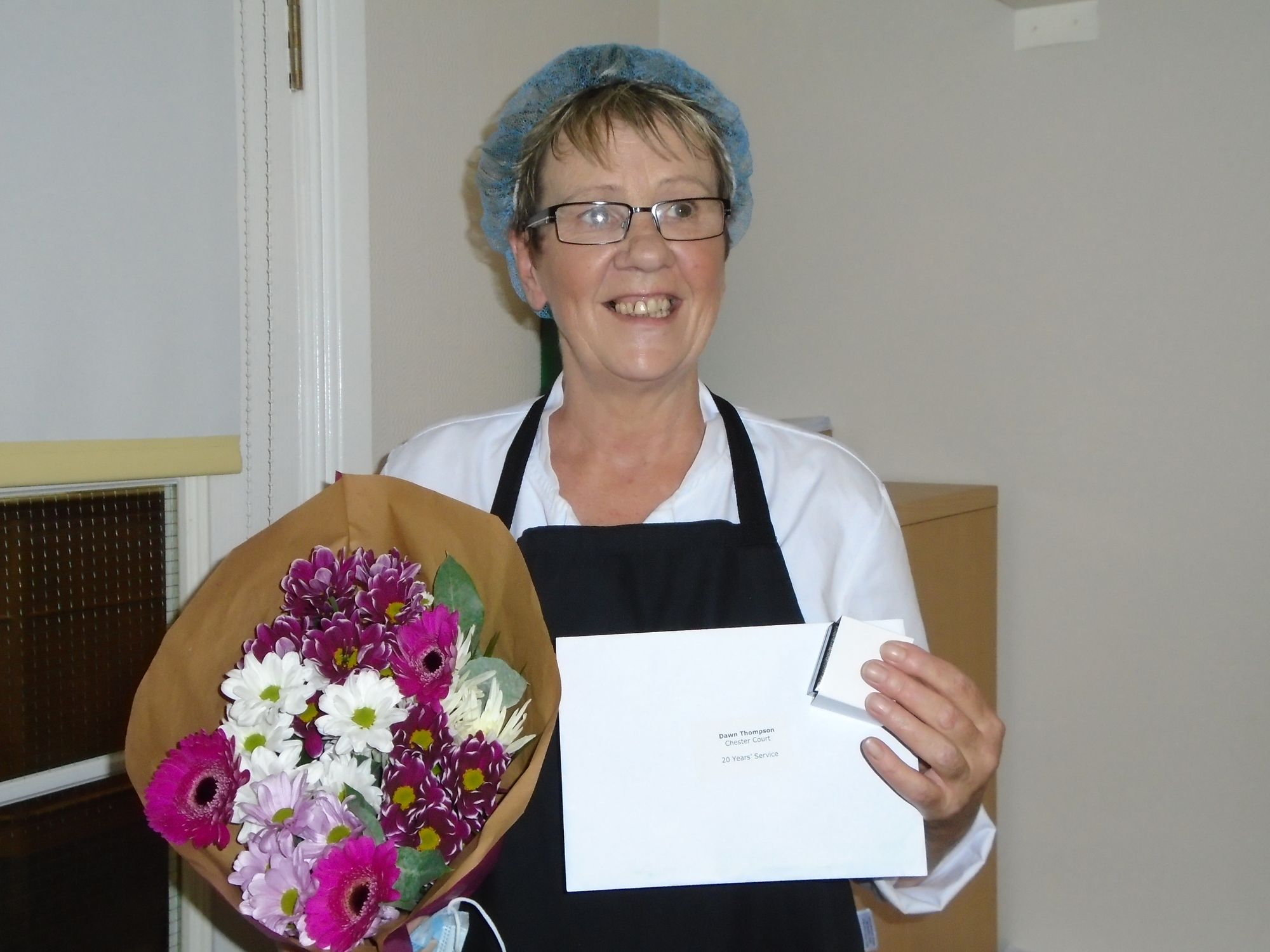 Staff celebrate a combined 30 years service with care home provider