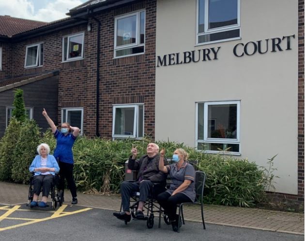 Care home residents salute the NHS spitfire