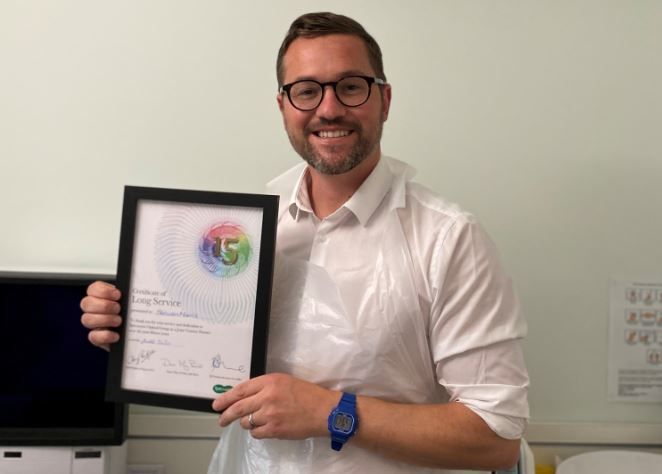 Specsavers employee celebrates 15 years in the job fixing eyesights