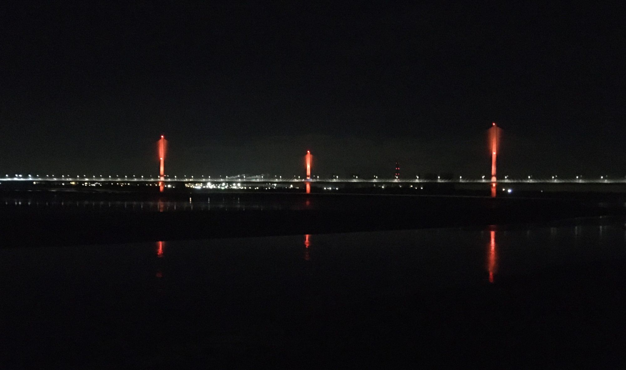 Bridge turns orange on day of calls for an end to violence towards women