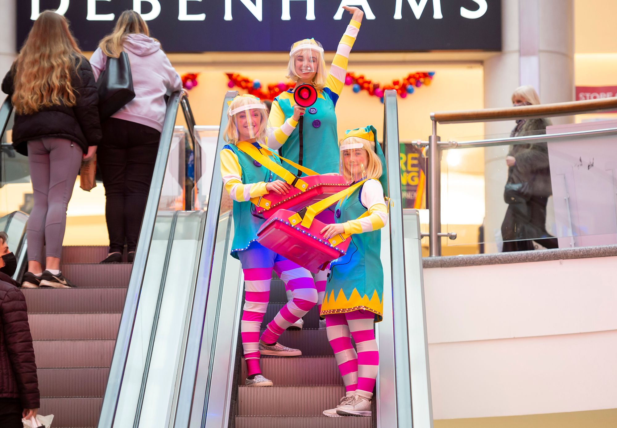 Elves spread Christmas cheer in Brighton shopping centre