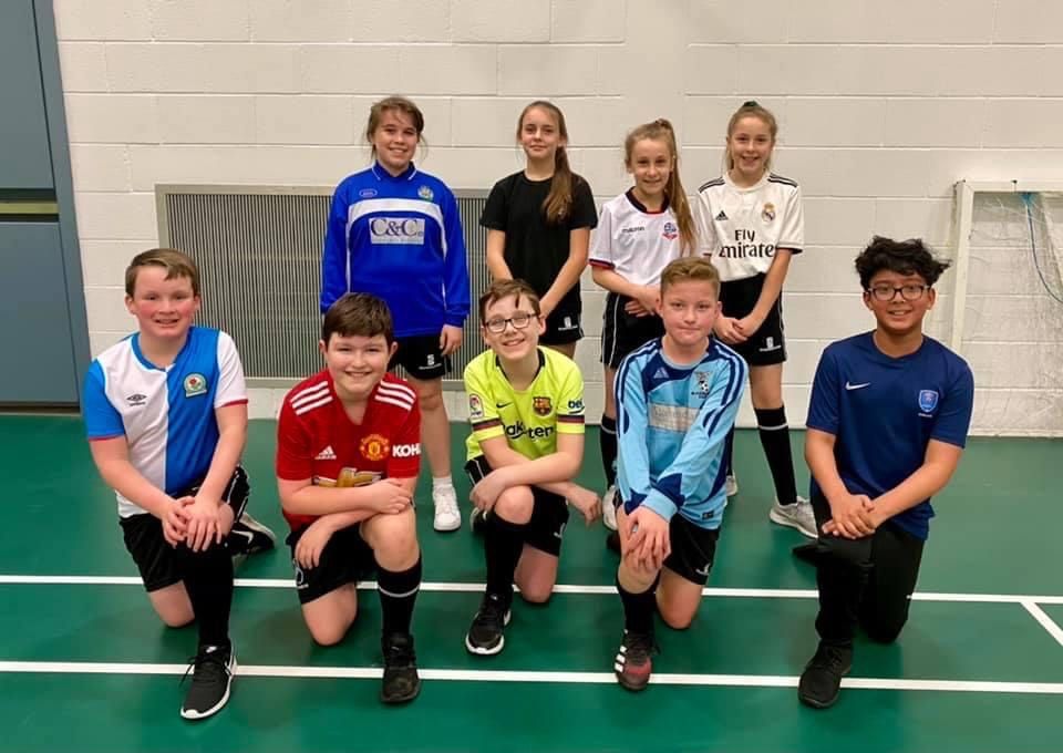 Football fan pupils don their favourite team's colours for charity