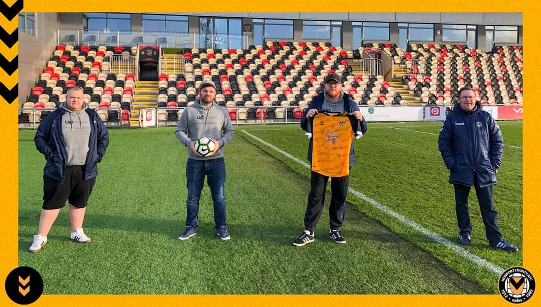 Trio call in at Liverpool on tour of football stadia for charity