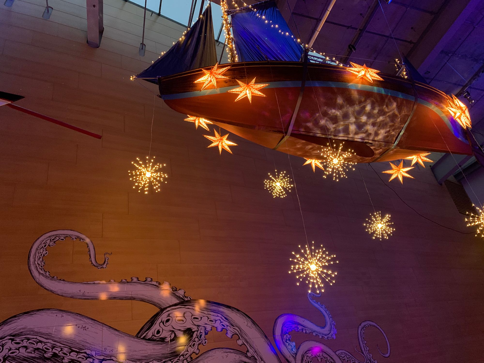 Maritime museum festooned with festive boats lights as it gets ready to reopen
