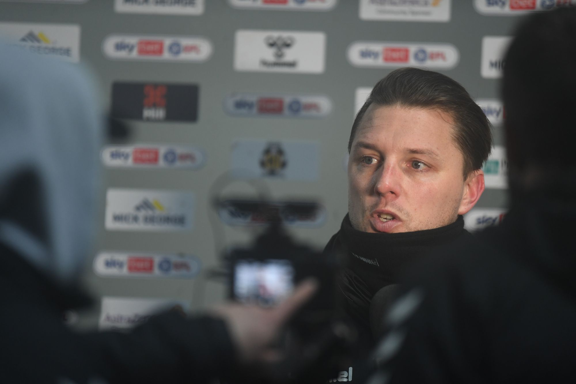Mark Bonner hails his Cambridge United side for competing at top of League Two with teams that have 'miles bigger' expectations