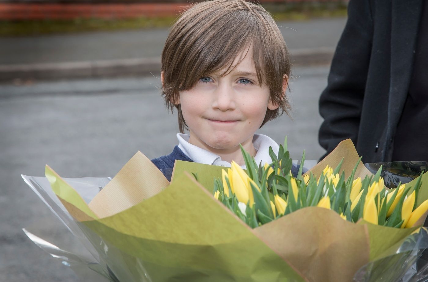 Pupils join in surprise celebrations for local resident's 100th birthday
