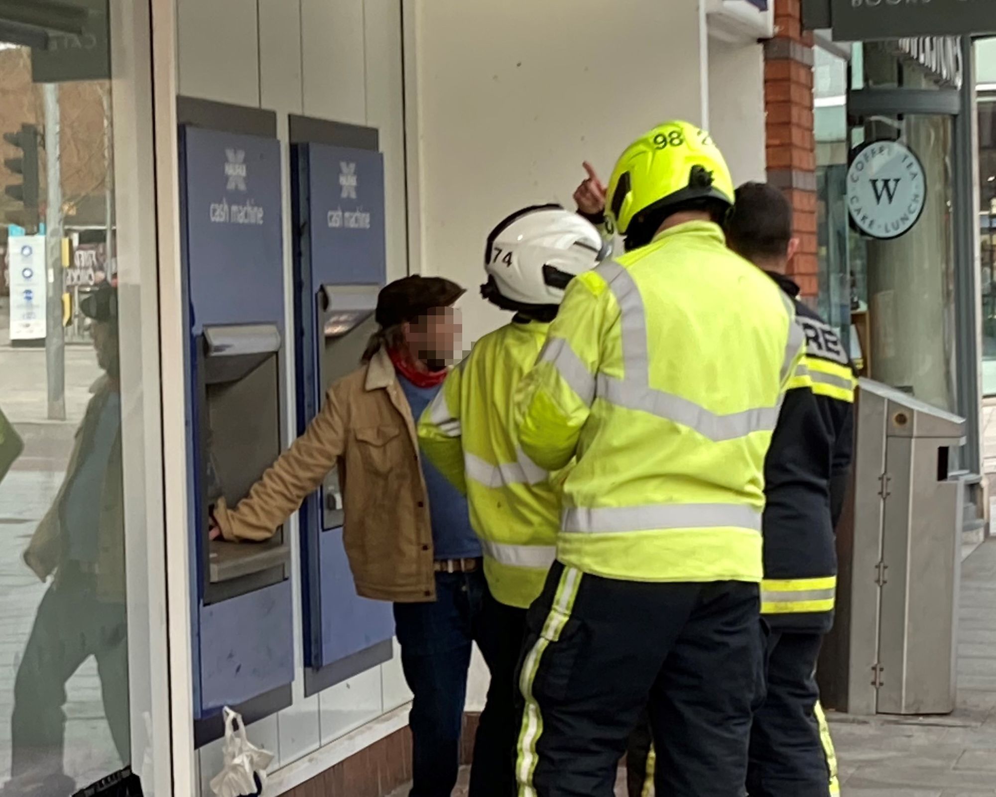 Man walks away uninjured after getting hand trapped in cash machine