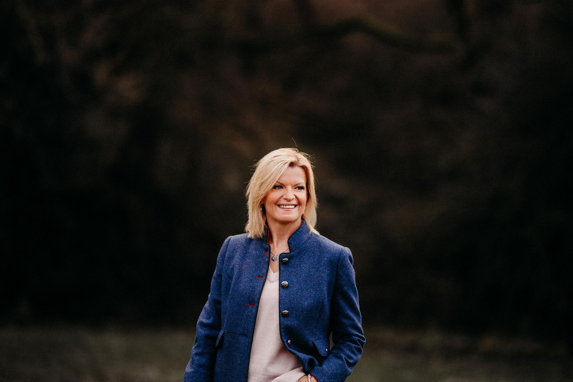 Former executive director writes book with first day profits donated to domestic violence charity