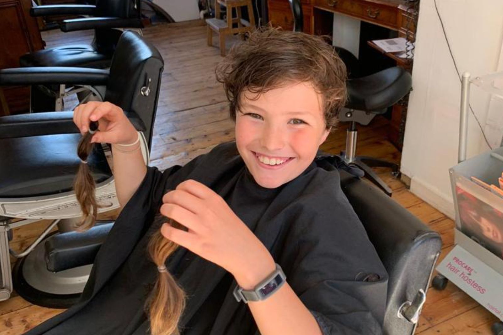 Cardiff schoolboy donates 12 inches of lockdown hair to charity