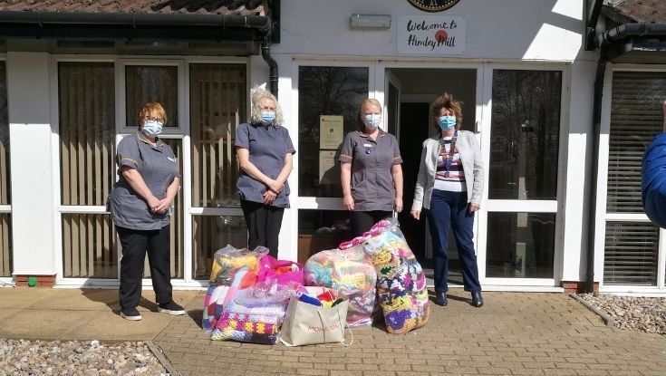 Women's group donate handmade blankets to Dudley care home