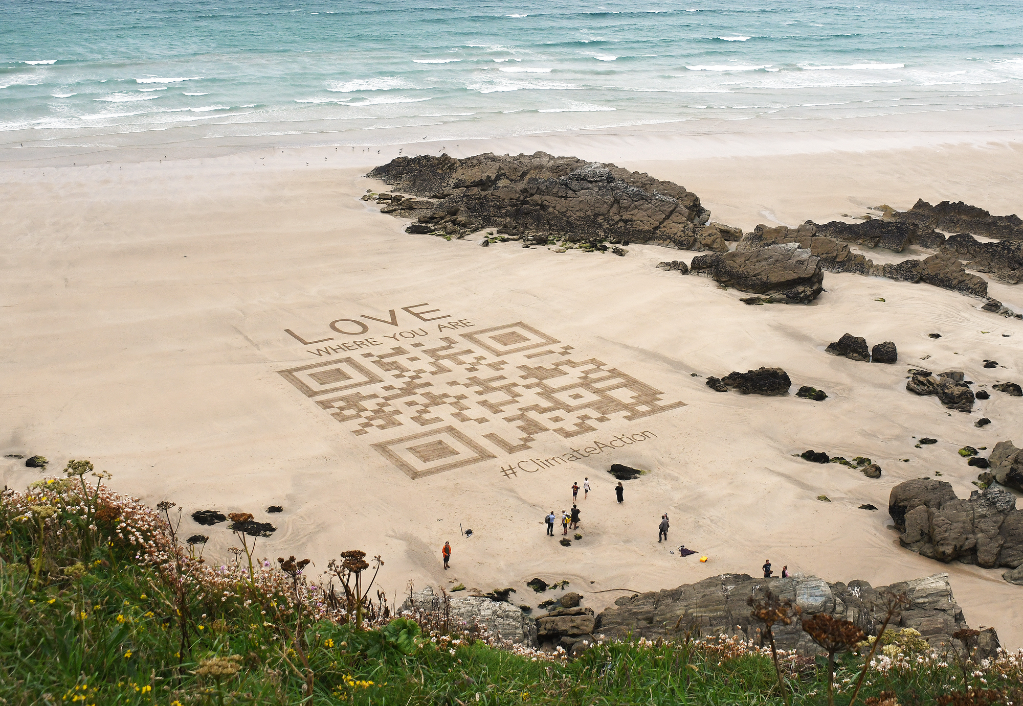 Giant sand art QR code on Newquay beach launches new #LoveWhereYouAre campaign
