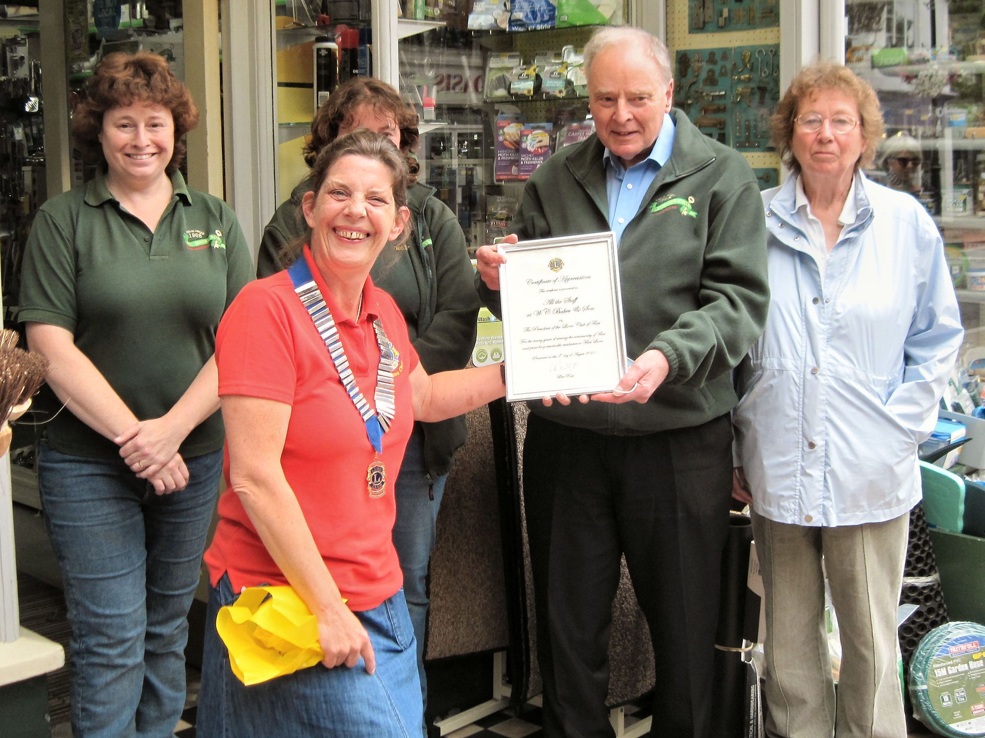 Fleet Lions Club present certificate of appreciation to WC Baker & Son ahead of closure