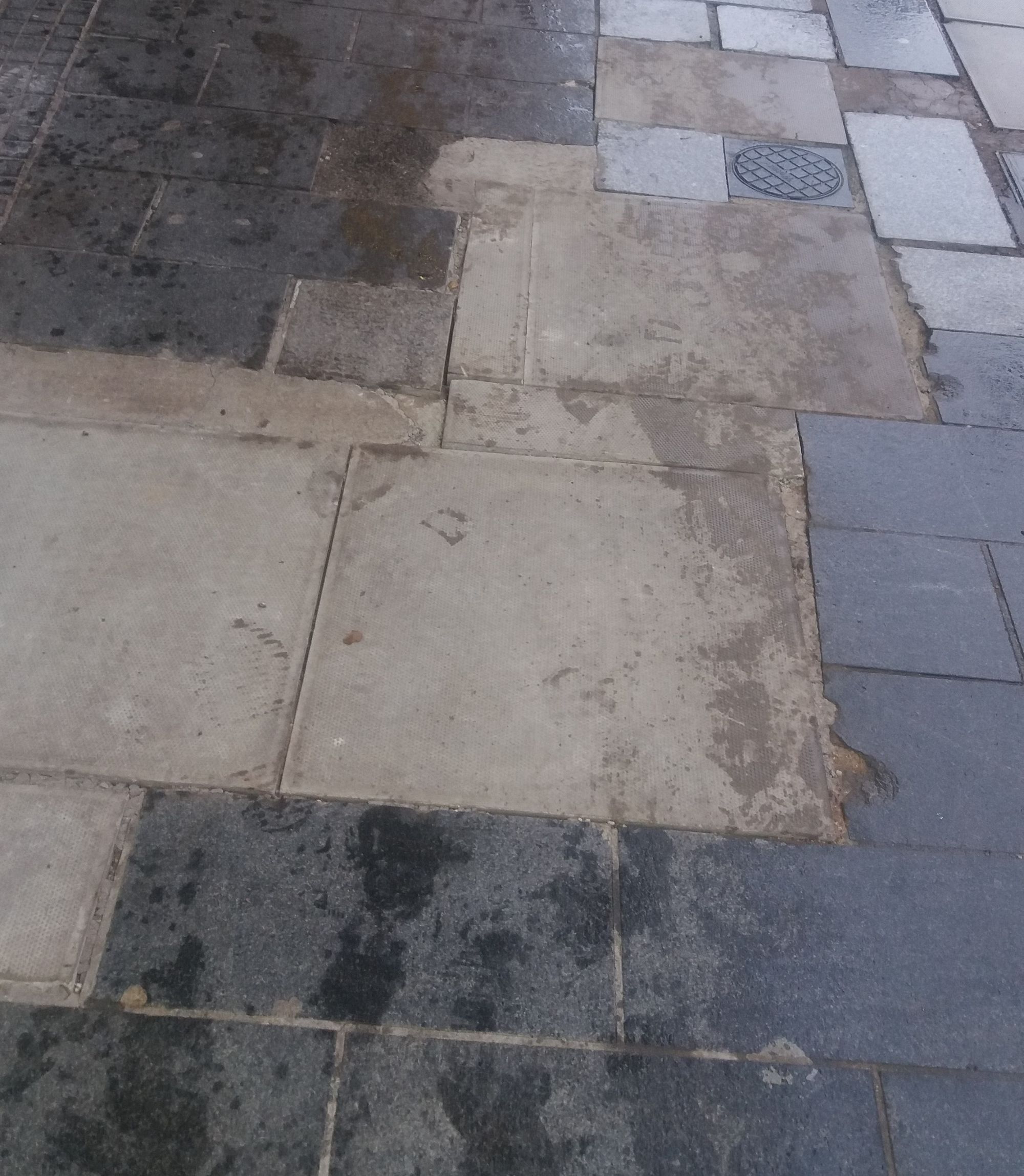 Fears someone will fall as shopping street left 'a complete mess'