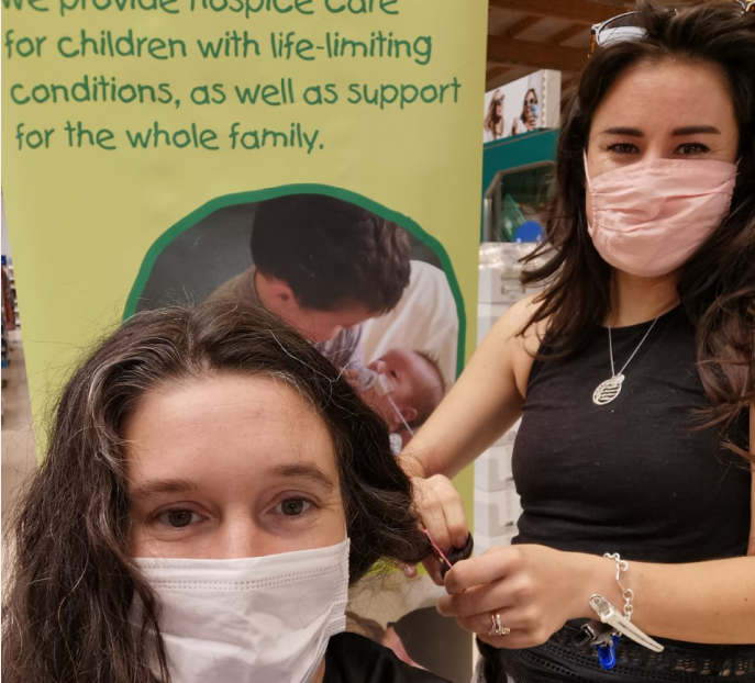 Callington community champion cuts long locks off for kids charity
