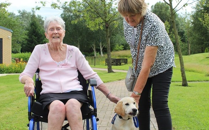 Hospice patient meets guide dog puppy named after her