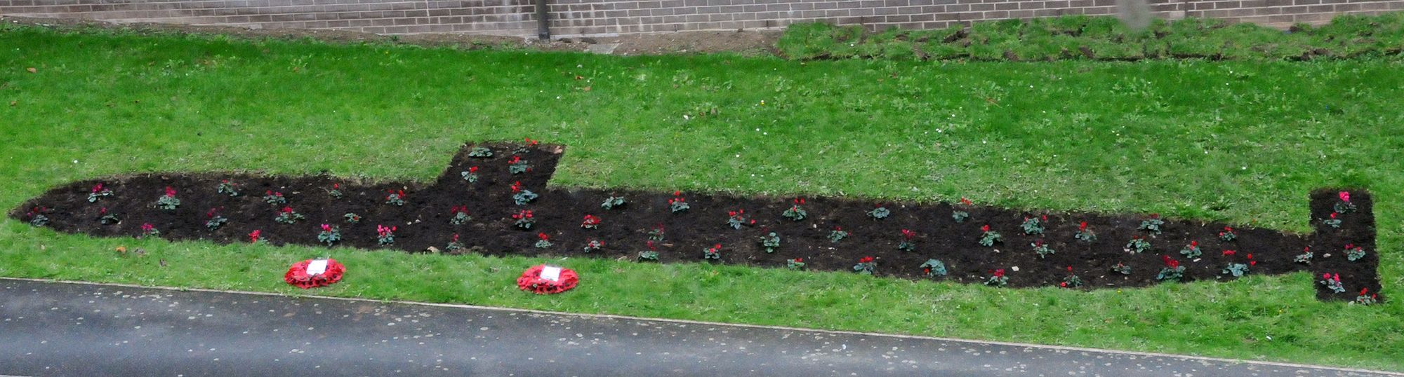 Memorial flower bed shaped like a submarine dedicated to Royal Navy submariners who lost their lives