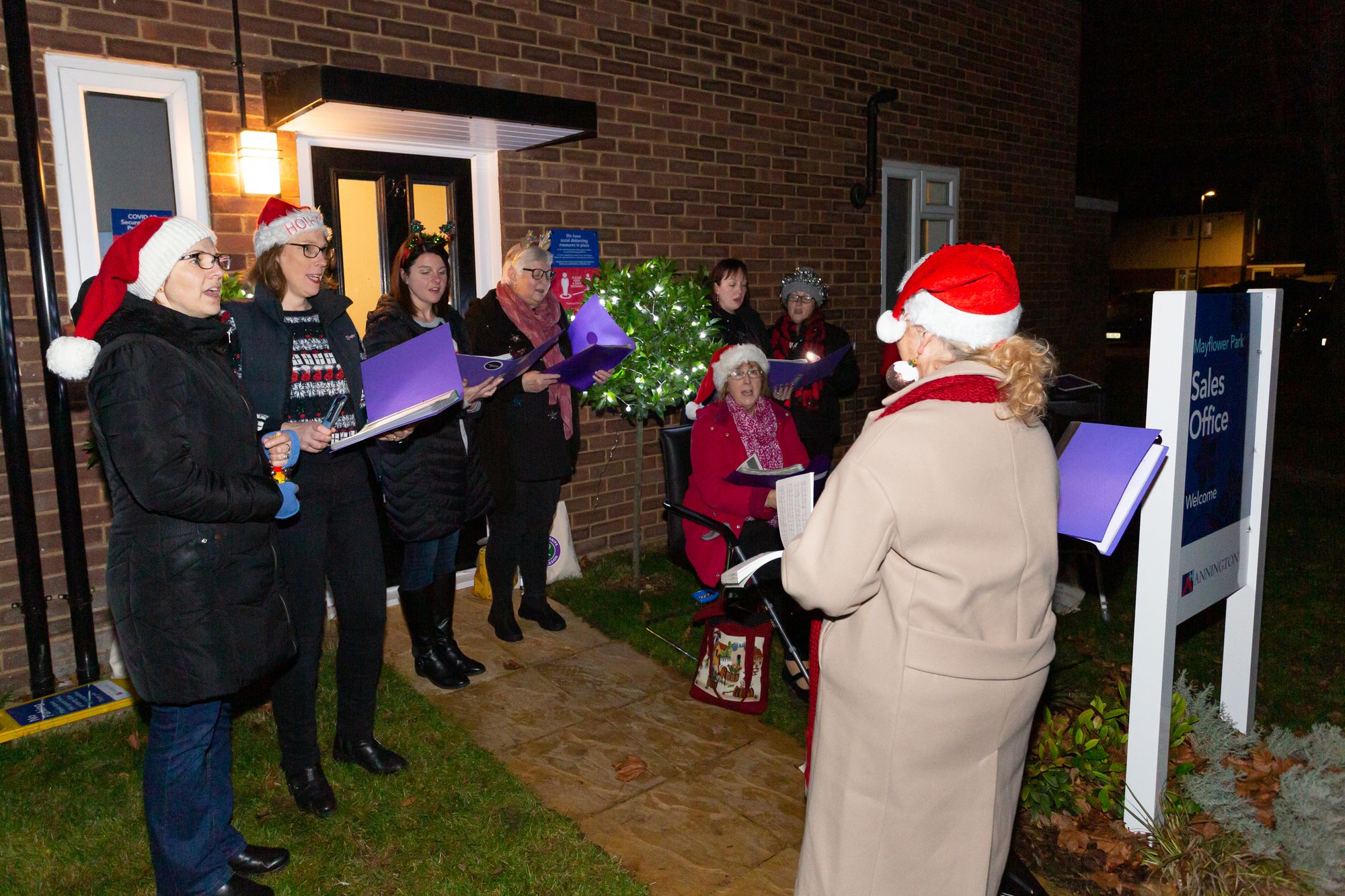 Carollers spread Christmas cheer to residents in Henlow
