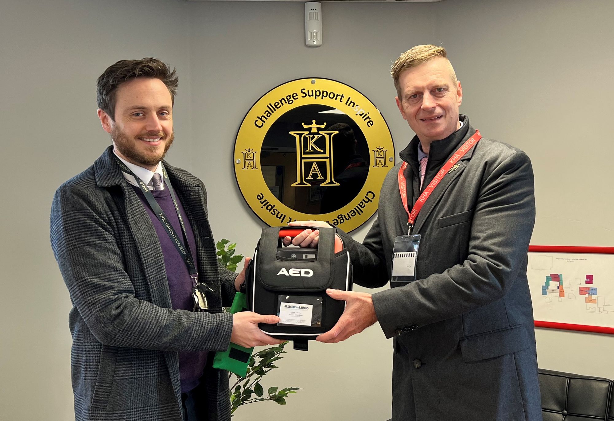 Waltham Abbey roofing contractor donates defibrillator to community