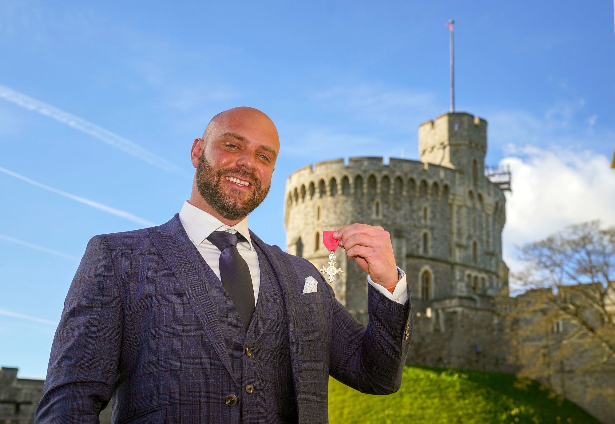 Personal trainer collects MBE after walking to Windsor from Middlesbrough