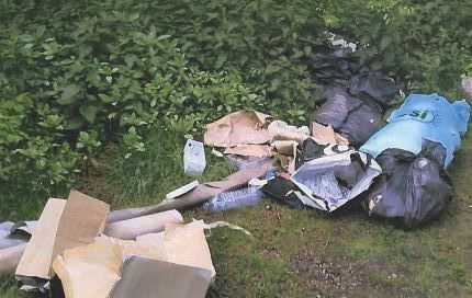 Two Heywood residents fined for fly-tipping
