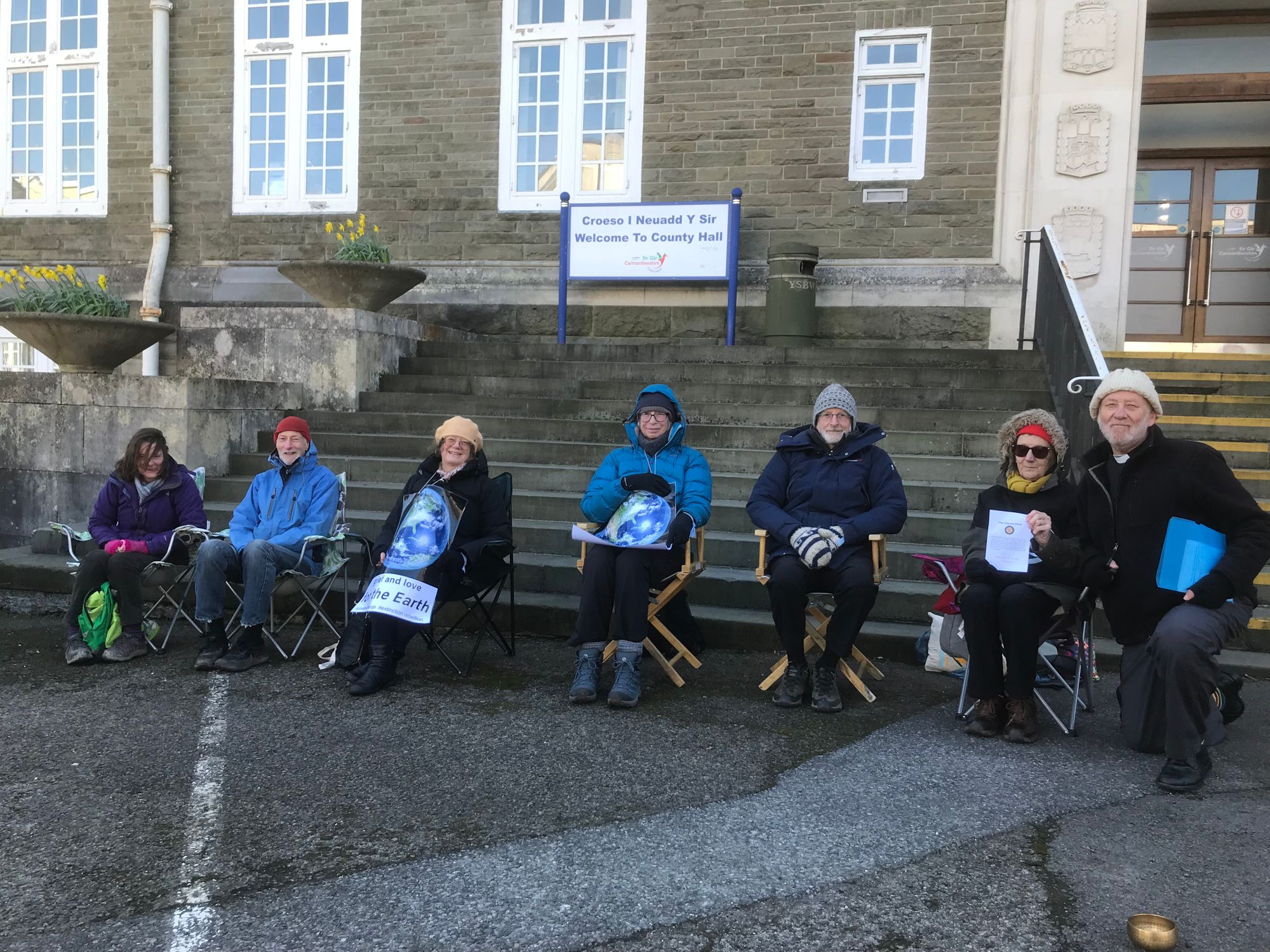 Climate crisis campaigners hold vigil outside County Hall in Carmarthen