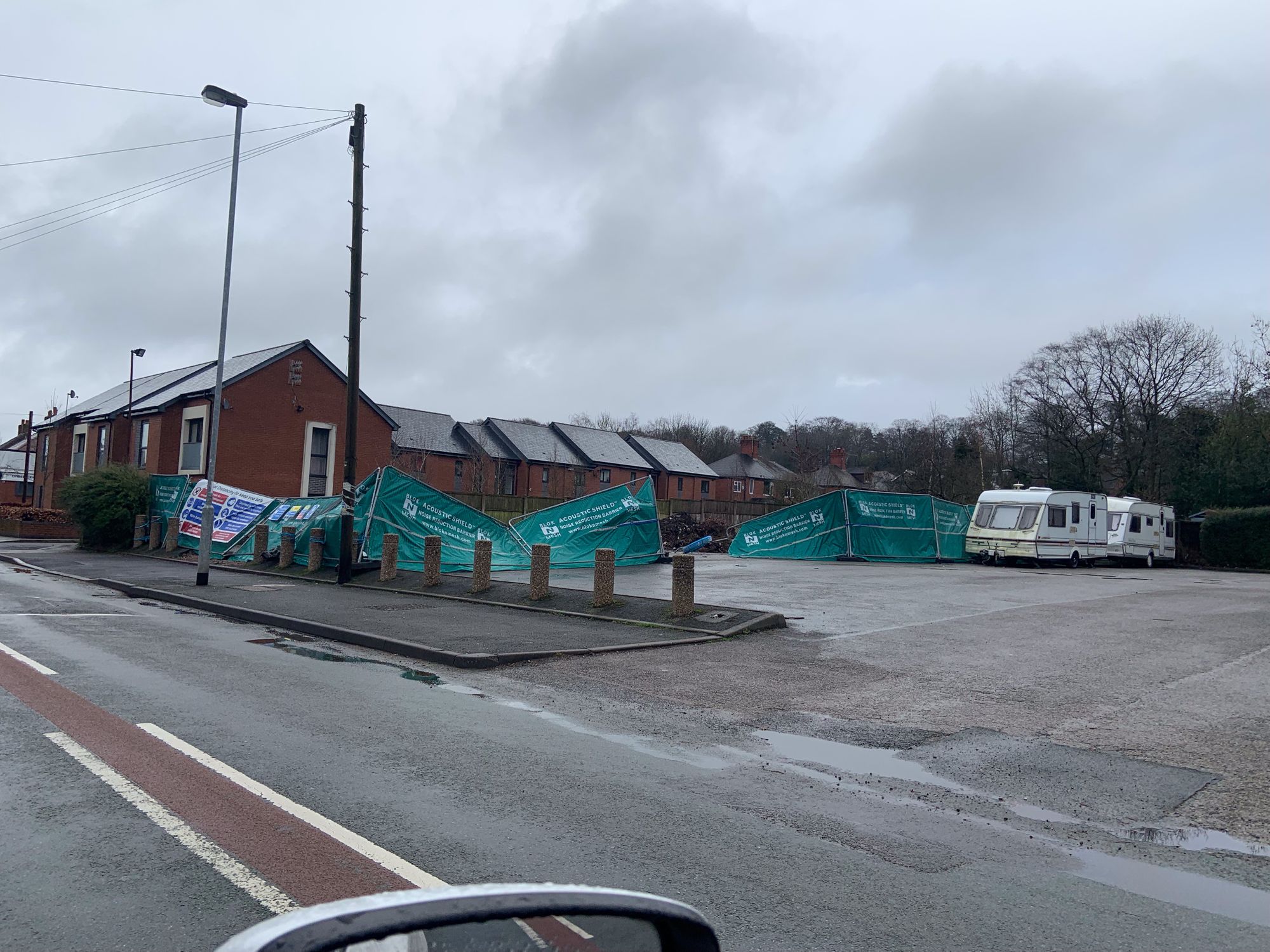 Fence causes damage as it blows about in the wind