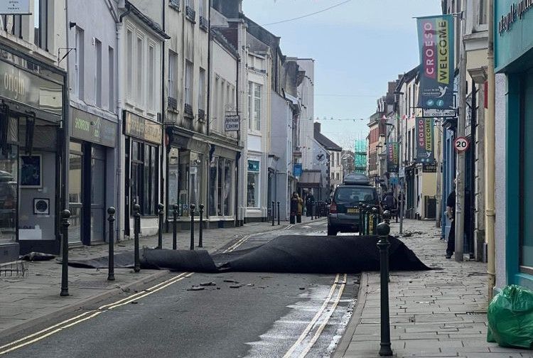 Chimney crashes into Carmarthen town centre road as Storm Eunice strikes