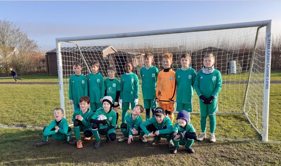 Bury St Edmunds football team celebrates cash award with new kit