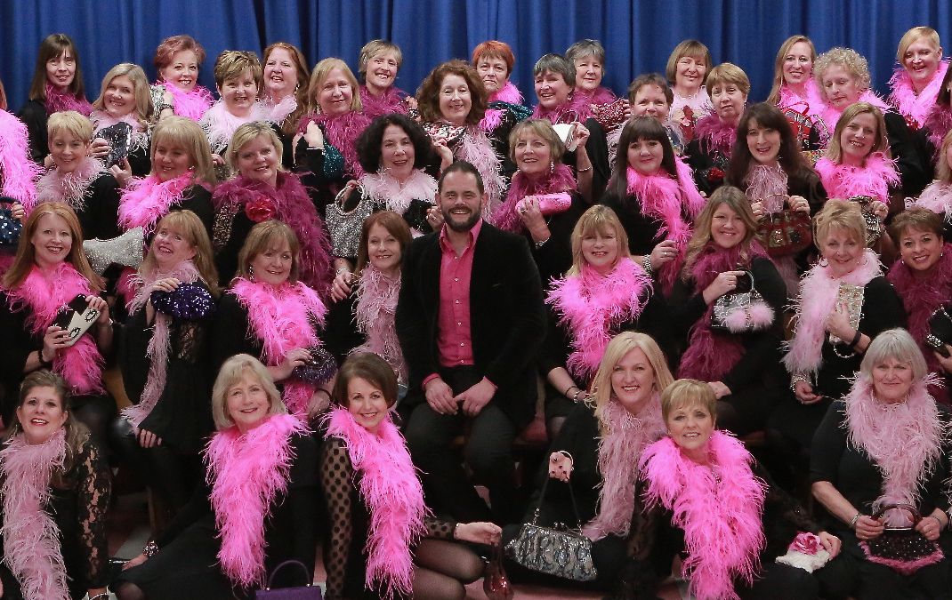 Bow Ties and Boas: Choirs join forces to celebrate 100 years of music between them