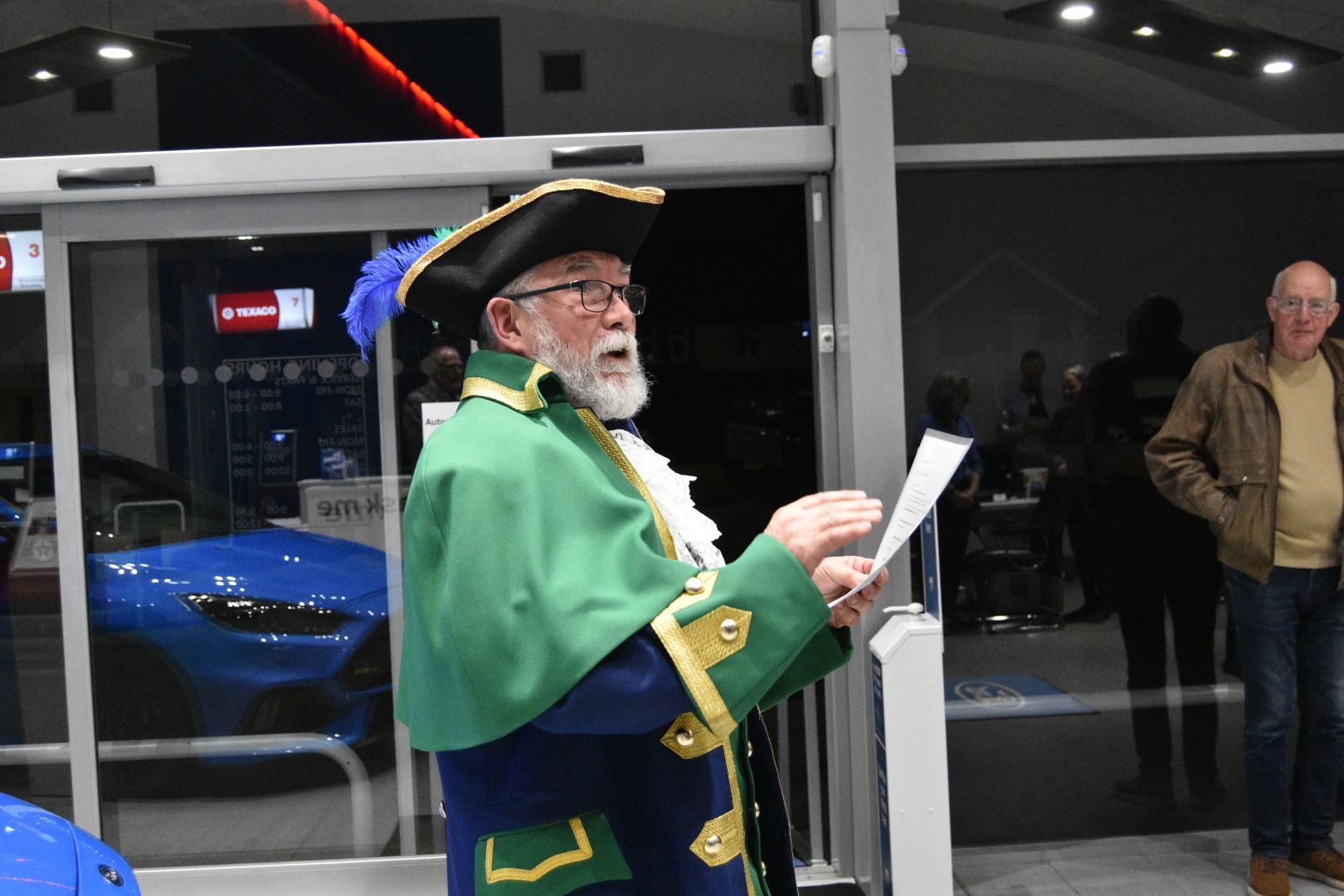 Lutterworth town crier visits local transport firm to announce electric vehicle launch